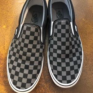 Black and grey checkered vans - slip on